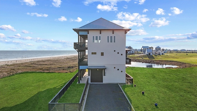 exterior space featuring driveway and a water view