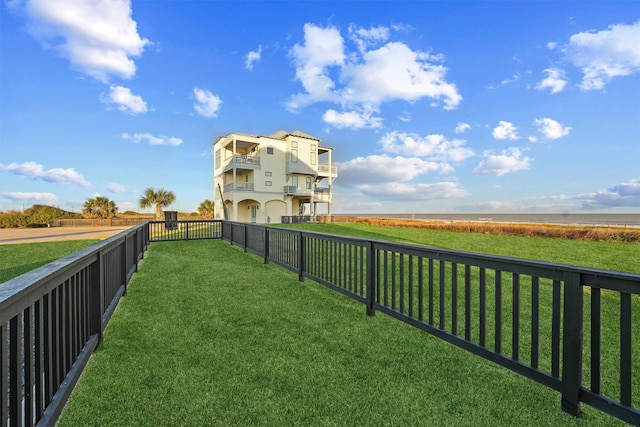 view of yard with a fenced backyard and a rural view