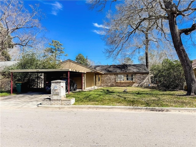 single story home with a carport, driveway, and a front lawn