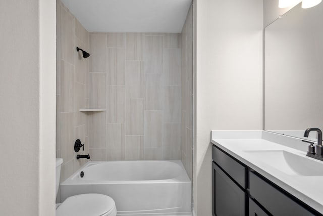 bathroom featuring tub / shower combination, vanity, and toilet