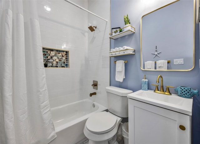 bathroom featuring vanity, shower / bath combo with shower curtain, and toilet