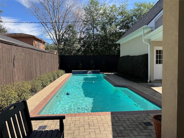 view of pool featuring a patio area, a fenced backyard, and a fenced in pool