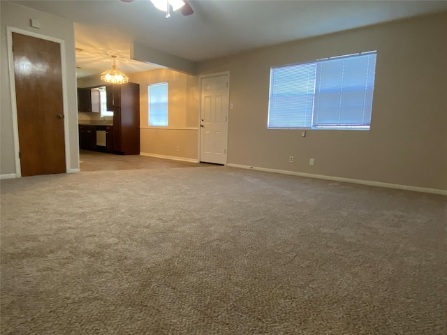 interior space featuring carpet floors and baseboards