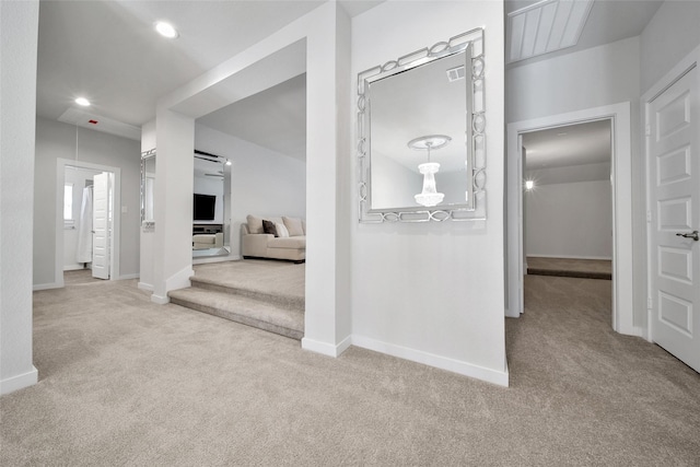 corridor featuring baseboards, carpet flooring, and recessed lighting