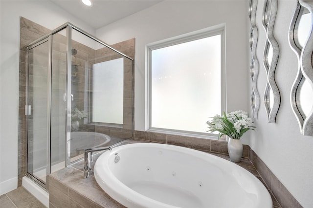 full bath featuring a whirlpool tub and a stall shower