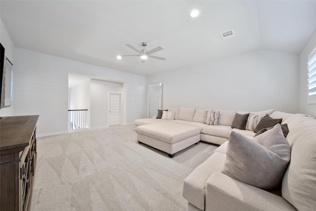 living area with recessed lighting, visible vents, light carpet, and baseboards