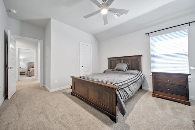 bedroom with baseboards, ceiling fan, lofted ceiling, and light colored carpet