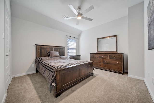 bedroom featuring baseboards, ceiling fan, lofted ceiling, and light colored carpet