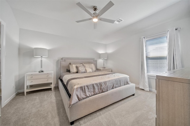 carpeted bedroom featuring baseboards, visible vents, and ceiling fan