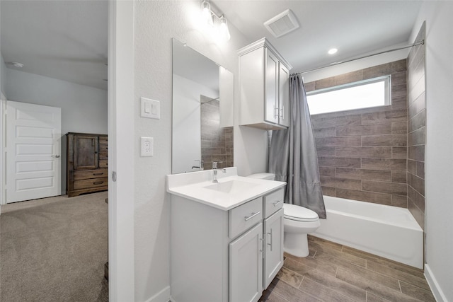 bathroom with visible vents, toilet, shower / bathtub combination with curtain, wood tiled floor, and vanity