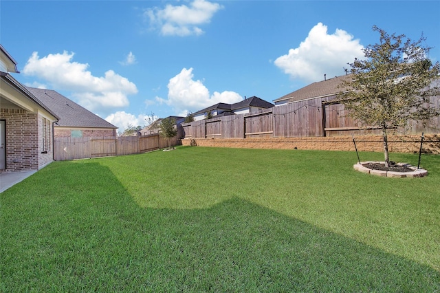 view of yard featuring a fenced backyard