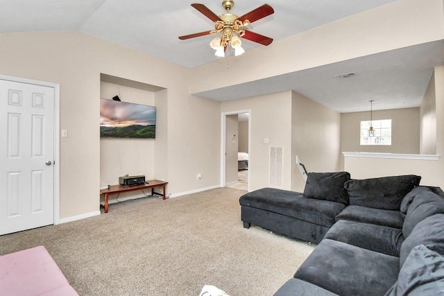 carpeted living room with visible vents, vaulted ceiling, and baseboards