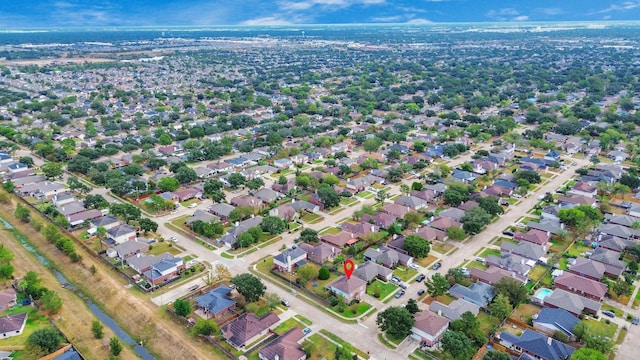 birds eye view of property with a residential view