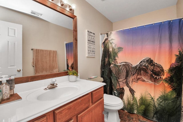 bathroom featuring toilet, curtained shower, vanity, and visible vents