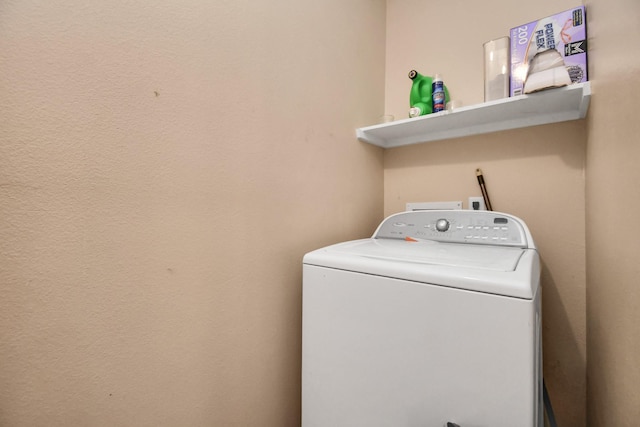 washroom featuring washer / clothes dryer and laundry area