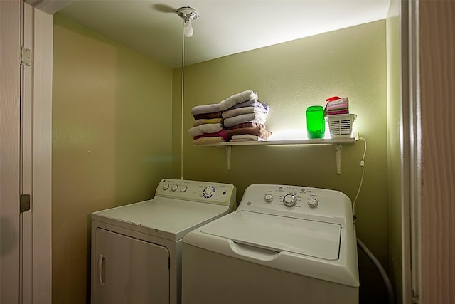 washroom featuring laundry area and separate washer and dryer