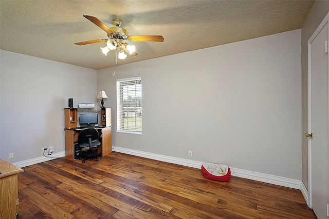 office area with baseboards, ceiling fan, a textured ceiling, and hardwood / wood-style floors