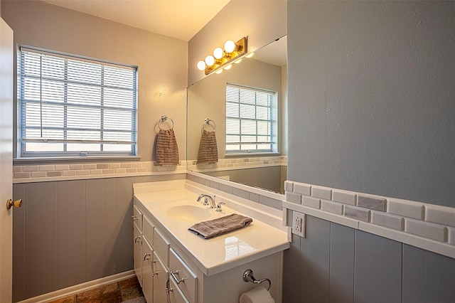 bathroom with wainscoting and vanity