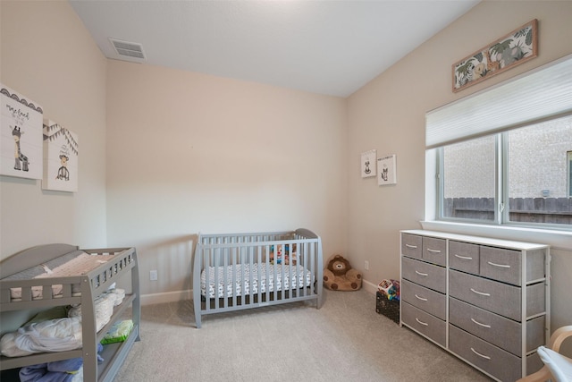 bedroom featuring baseboards, visible vents, and carpet flooring