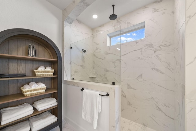 full bathroom featuring marble finish floor, a marble finish shower, and recessed lighting