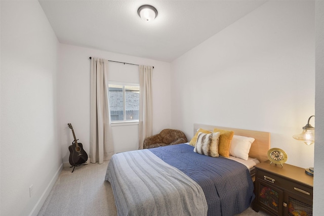 carpeted bedroom with baseboards