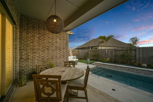 exterior space featuring outdoor dining area and a patio