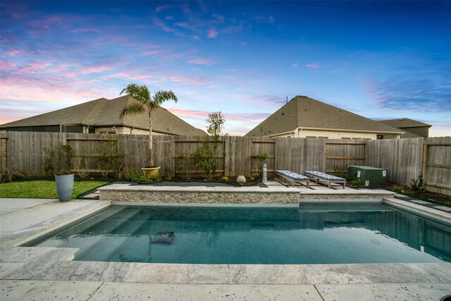 view of pool featuring a patio, a fenced backyard, and a fenced in pool