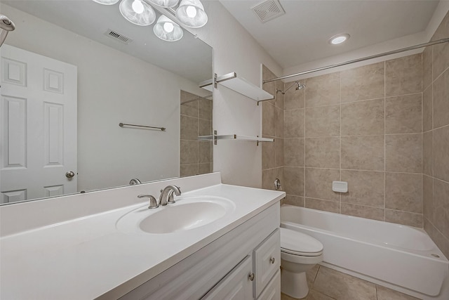 bathroom featuring toilet, bathtub / shower combination, visible vents, and tile patterned floors