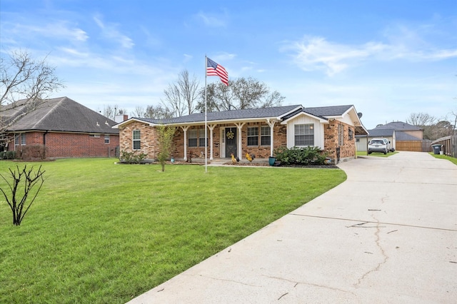 single story home with brick siding, covered porch, board and batten siding, driveway, and a front lawn