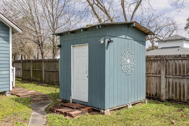 view of shed featuring a fenced backyard