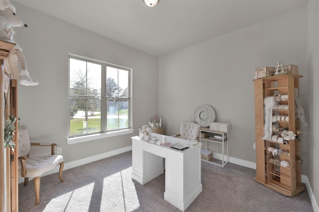 home office with baseboards and light colored carpet