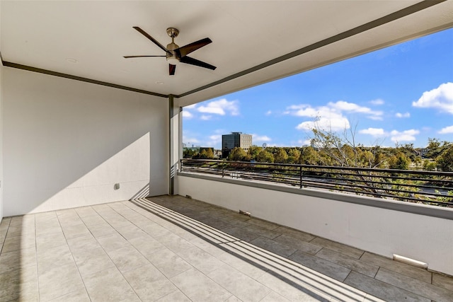 balcony featuring a ceiling fan and a city view