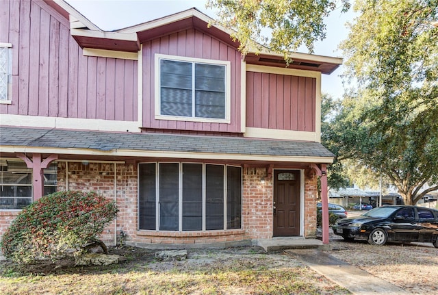 multi unit property featuring board and batten siding and brick siding