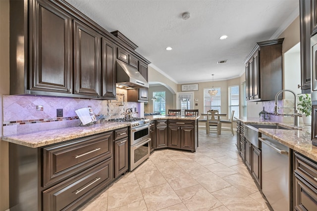 2433 La Rochelle Ct, Seabrook, TX 77586 - kitchen featuring ornamental molding, arched walkways, a sink, appliances with stainless steel finishes, and exhaust hood