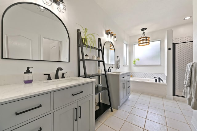2433 La Rochelle Ct, Seabrook, TX 77586 - bathroom with a bath, two vanities, a sink, and tile patterned flooring