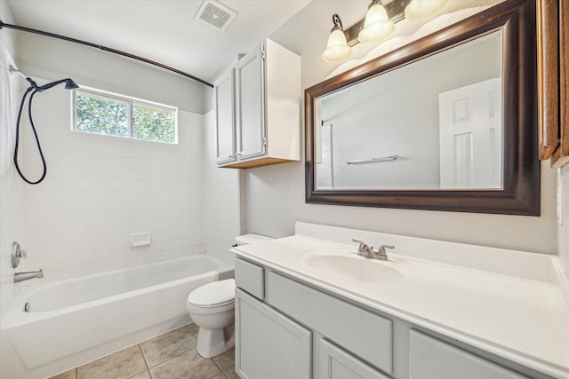 full bathroom featuring bathing tub / shower combination, visible vents, toilet, vanity, and tile patterned floors