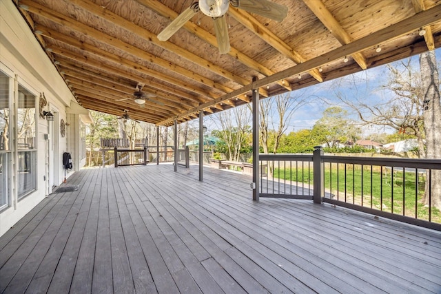 wooden deck featuring ceiling fan