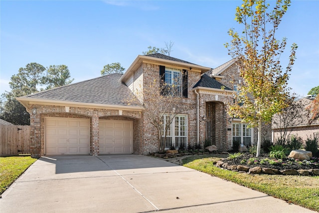 view of front of house featuring brick siding, a shingled roof, concrete driveway, fence, and a garage