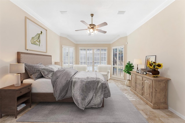 bedroom with vaulted ceiling, crown molding, baseboards, and ceiling fan