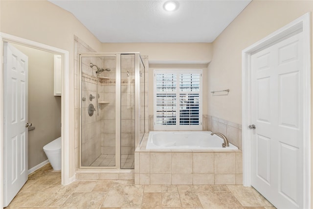 bathroom featuring a garden tub, a shower stall, and toilet