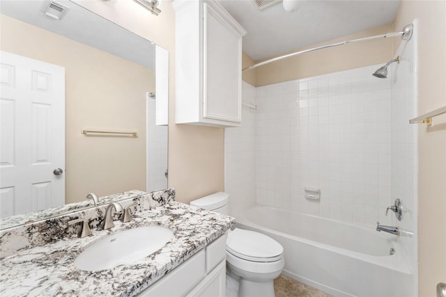 bathroom featuring washtub / shower combination, visible vents, vanity, and toilet