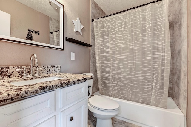 bathroom featuring toilet, shower / bath combo, vanity, a textured ceiling, and tile patterned floors