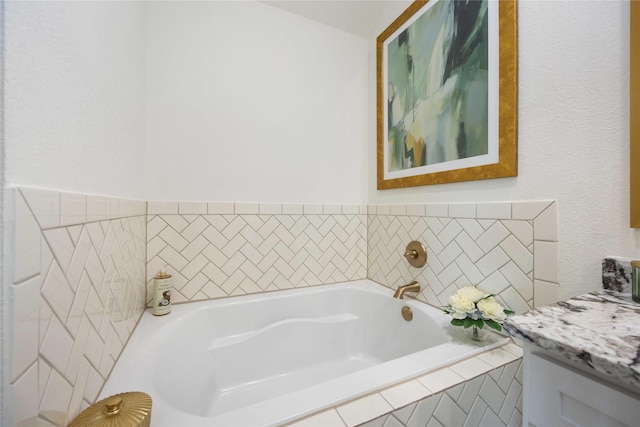 full bathroom featuring a bath and vanity