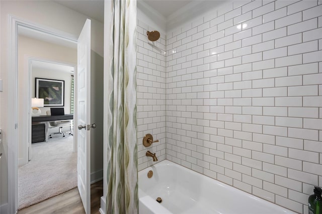 full bath featuring wood finished floors and shower / bath combo with shower curtain