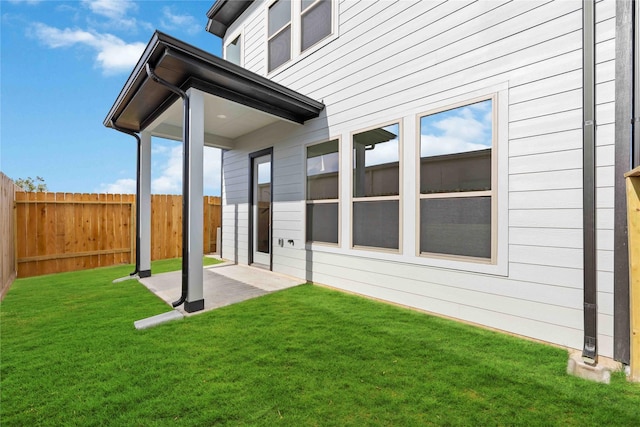 view of yard featuring a patio and fence