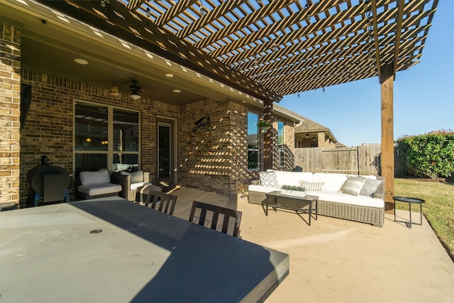 view of patio / terrace featuring an outdoor hangout area, ceiling fan, fence, and a pergola