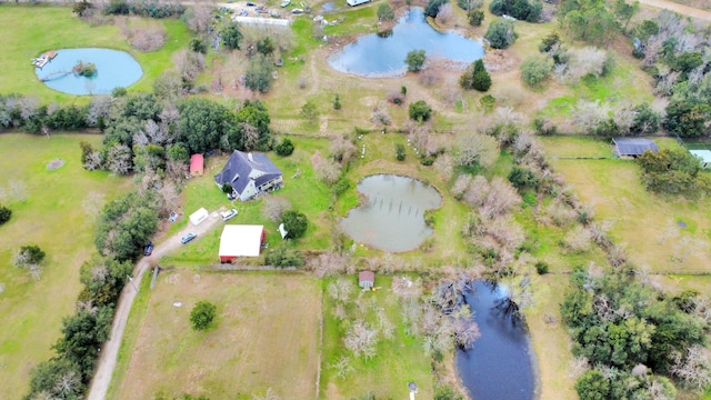 bird's eye view with a water view and a rural view