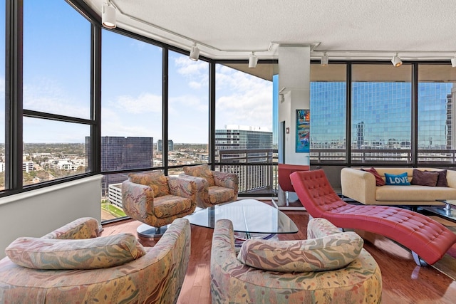 sunroom featuring a view of city