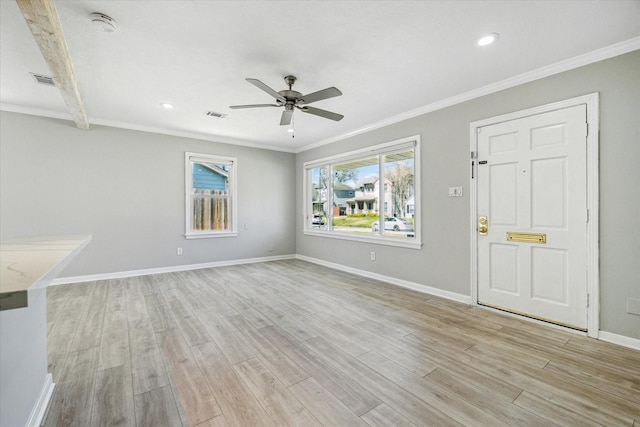 unfurnished living room featuring light wood finished floors, baseboards, and ornamental molding