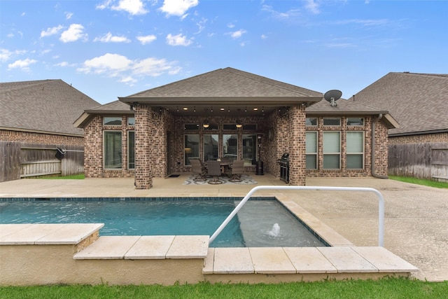 view of swimming pool with a fenced in pool, a patio area, a fenced backyard, and area for grilling